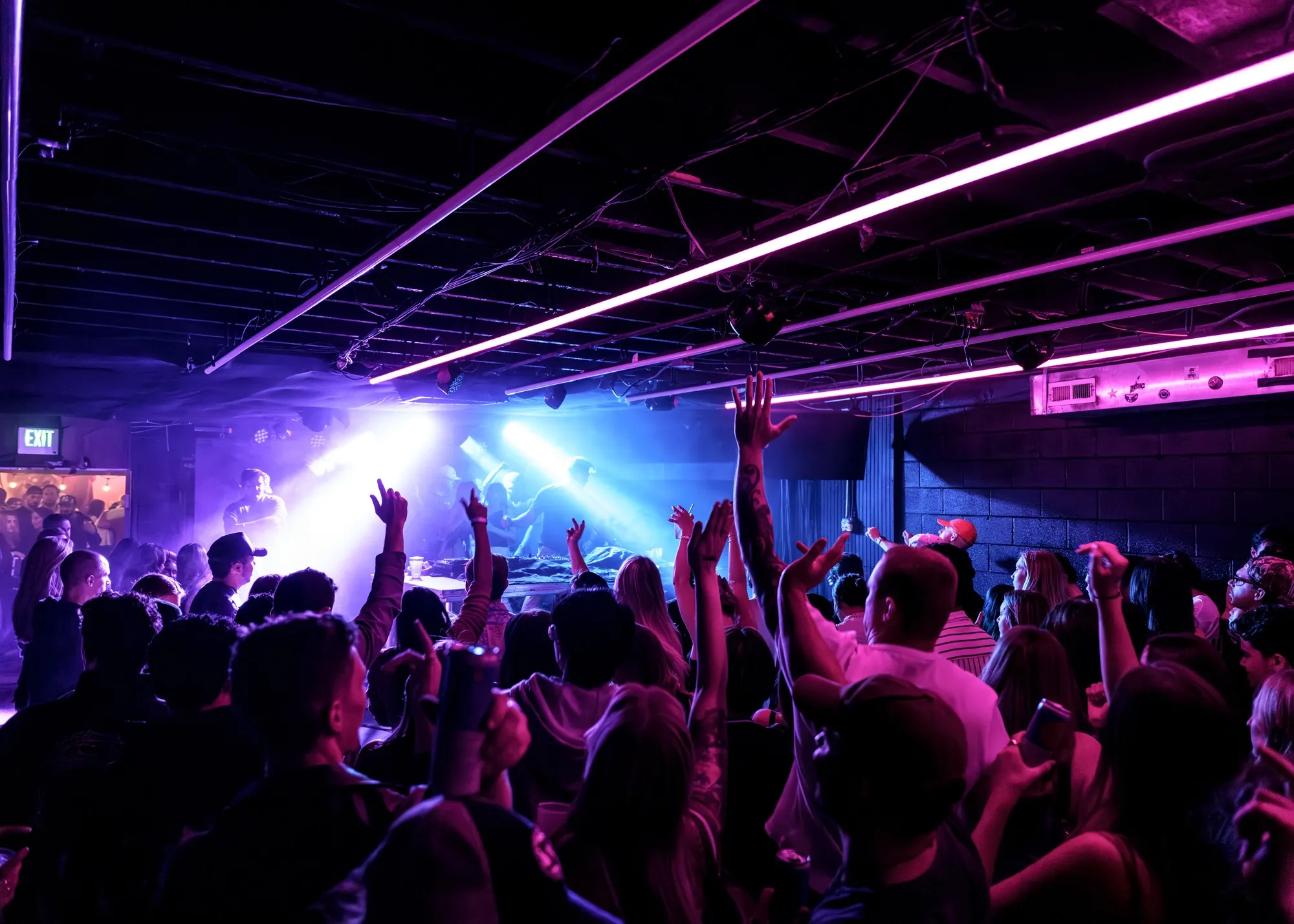 Crowd under purple lasers at Larimer Lounge